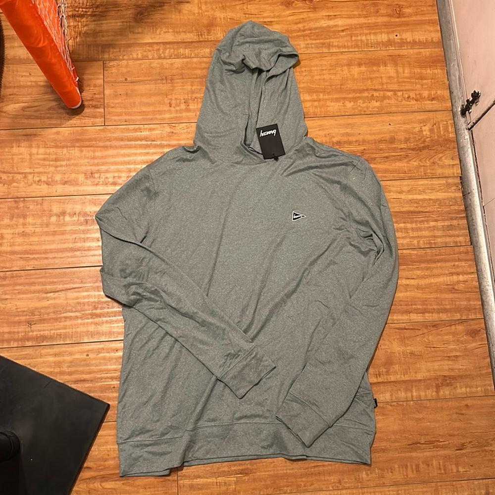 Large greenish grey pullover with hood.